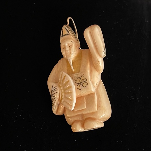 netsuke altered to wear on a gold neck wire 14kt gold bale...